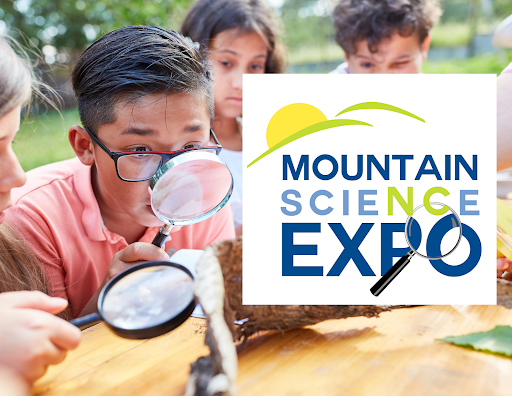 Alt text: A photo of children examining a log with magnifying glasses with the Mountain Science Expo overlaid on top. 