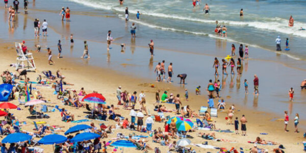 Photo of a crowded beach covered with umbrellas in Ocean City, Maryland, courtesy of iStock