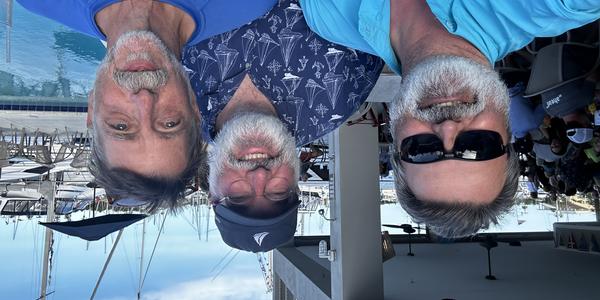  NCEI’s Jeff Arnfield, Rost Parsons, and Scott Cross pose before the Gulfstreamer Race in May 2024. 