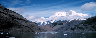 Photo of snow-covered Mount St. Elias from Icy Bay, South Central Alaska