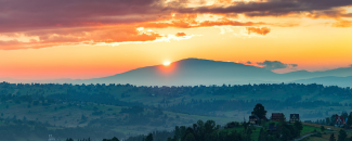 Photo of a sunset over mountains in Poland
